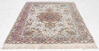 A Tabriz carpet north west Persia, part silk, c. 314 x 197 cm.