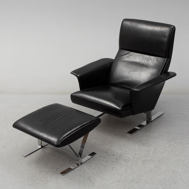 A second half of the 20th century easy chair and stool by Georg Thams, Vejens Polstermöbelfabrik, Denmark.