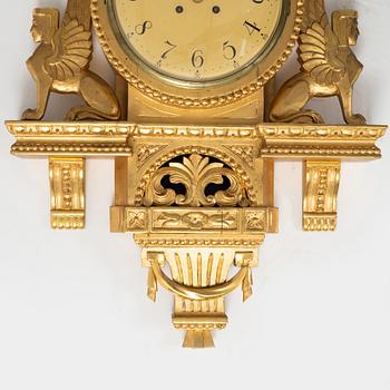 An Empire style wall clock, mid 20th century.