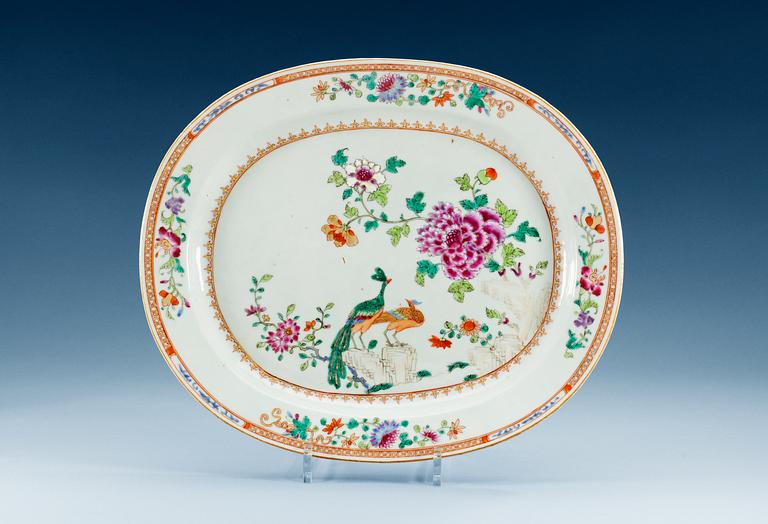A famille rose 'double peacock' serving dish, Qing dynasty, Qianlong (1736-95).