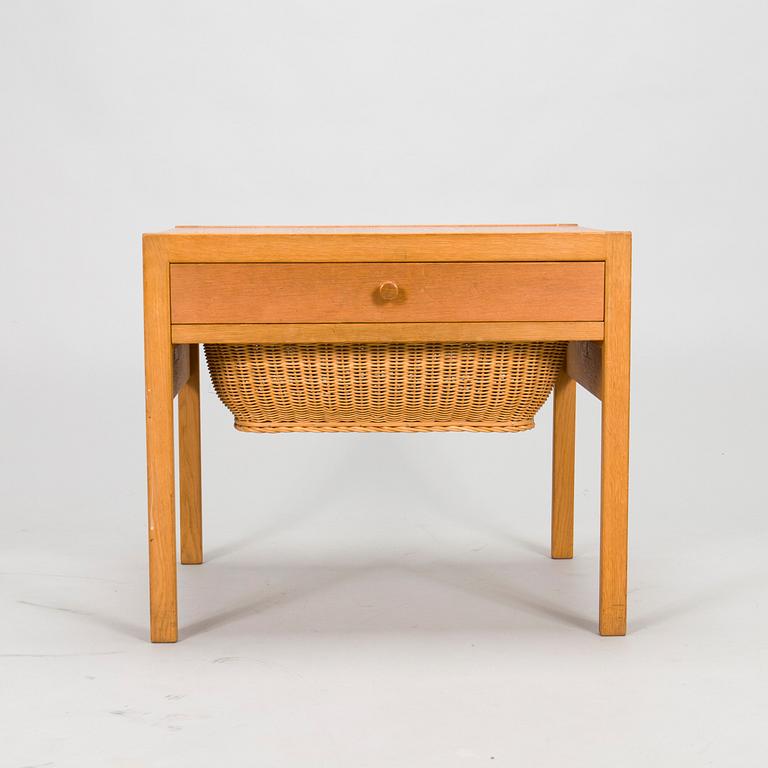 A mid-20th-century sewing table.