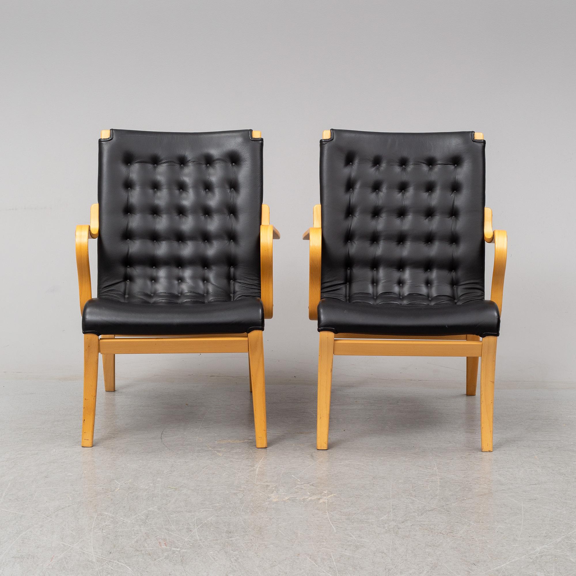 A pair of 'Mina' chairs designed by Bruno Mathsson, Bruno Mathsson International, Värnamo, Sweden.