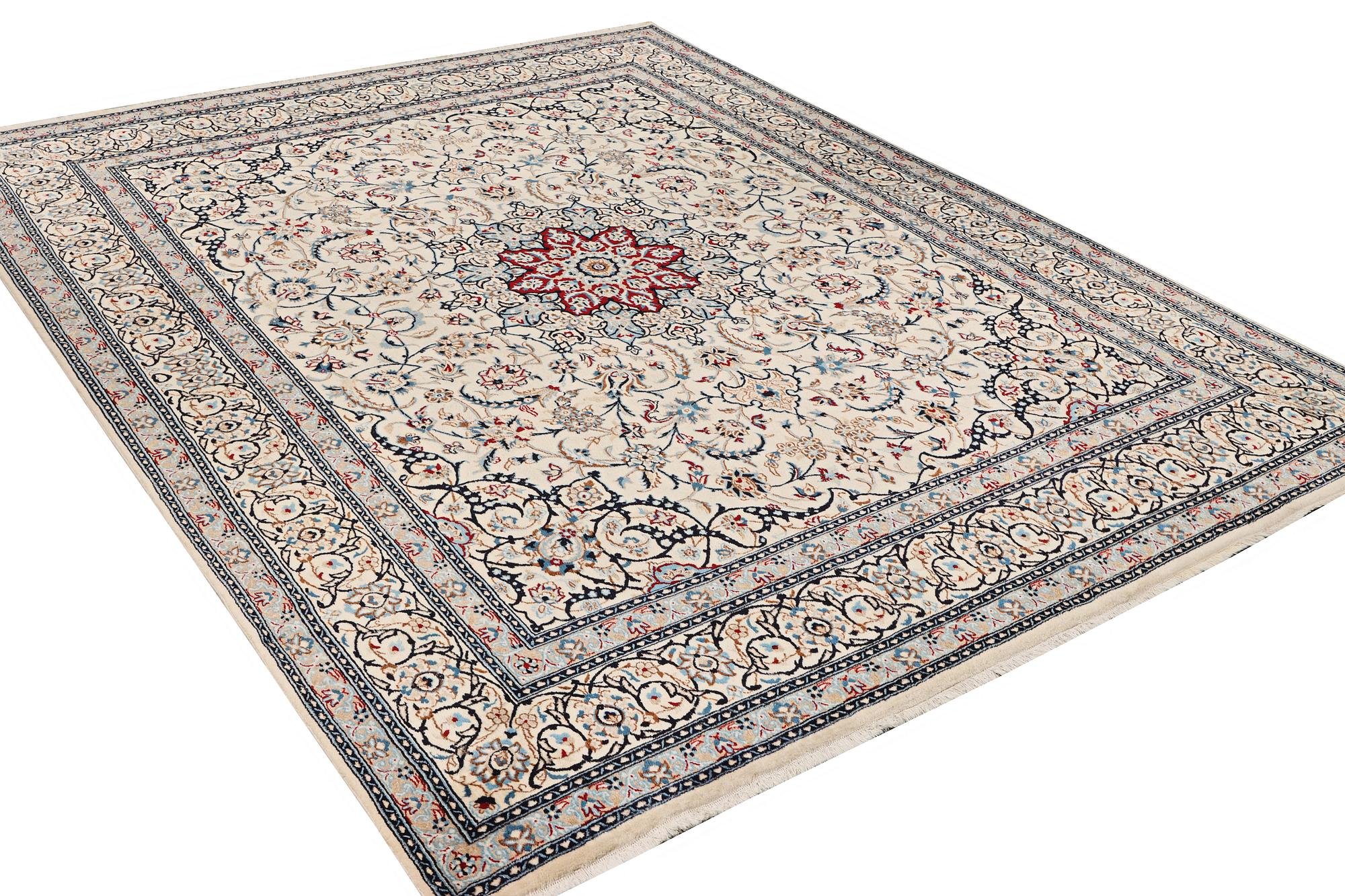 A Nain carpet, part silk, 9 laa, c. 390 x 295 cm.
