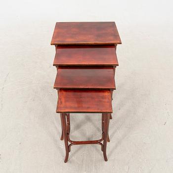An early 19th century nest of four tables in stained beech from Thonet.