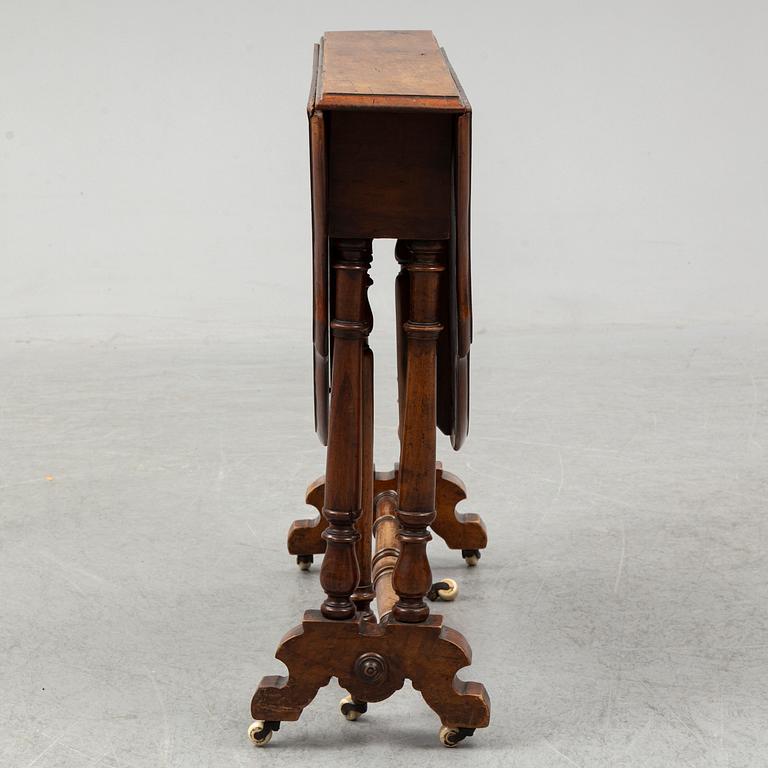 A 19th Century drop leaf table.