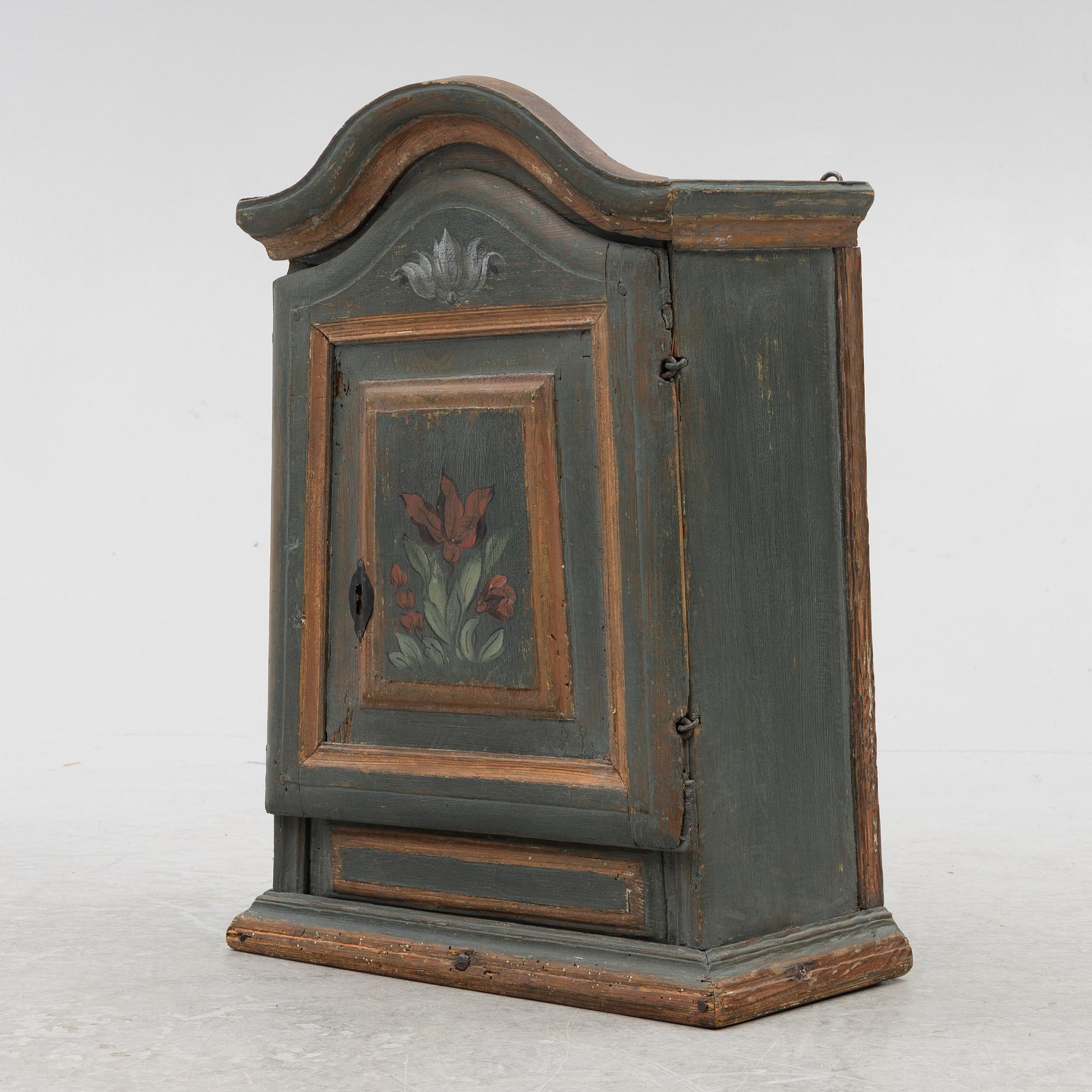 A painted wall cabinet, 19th century.