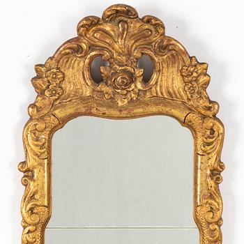 A Rococo mirror, 18th Century.