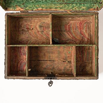 A presumably German baroque repoussé brass writing box, late 17th century.