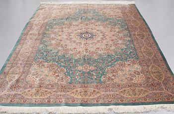 A CARPET, Old silk Qum, signed Moghadam, ca 309,5 x 190,5 - 193 cm.