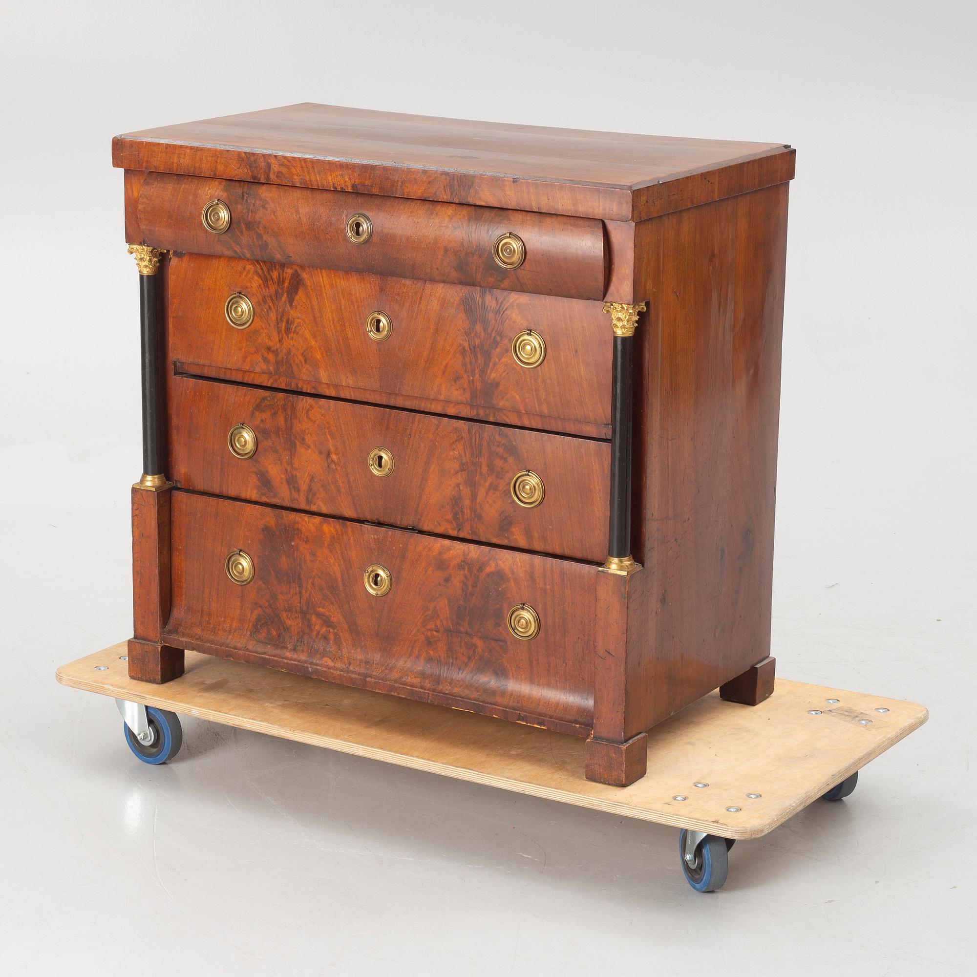 An Empire chest of drawers, first half of the/mid 19th century.