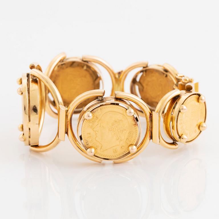 An 18K gold bracelet set with Mexican 22K gold coins.