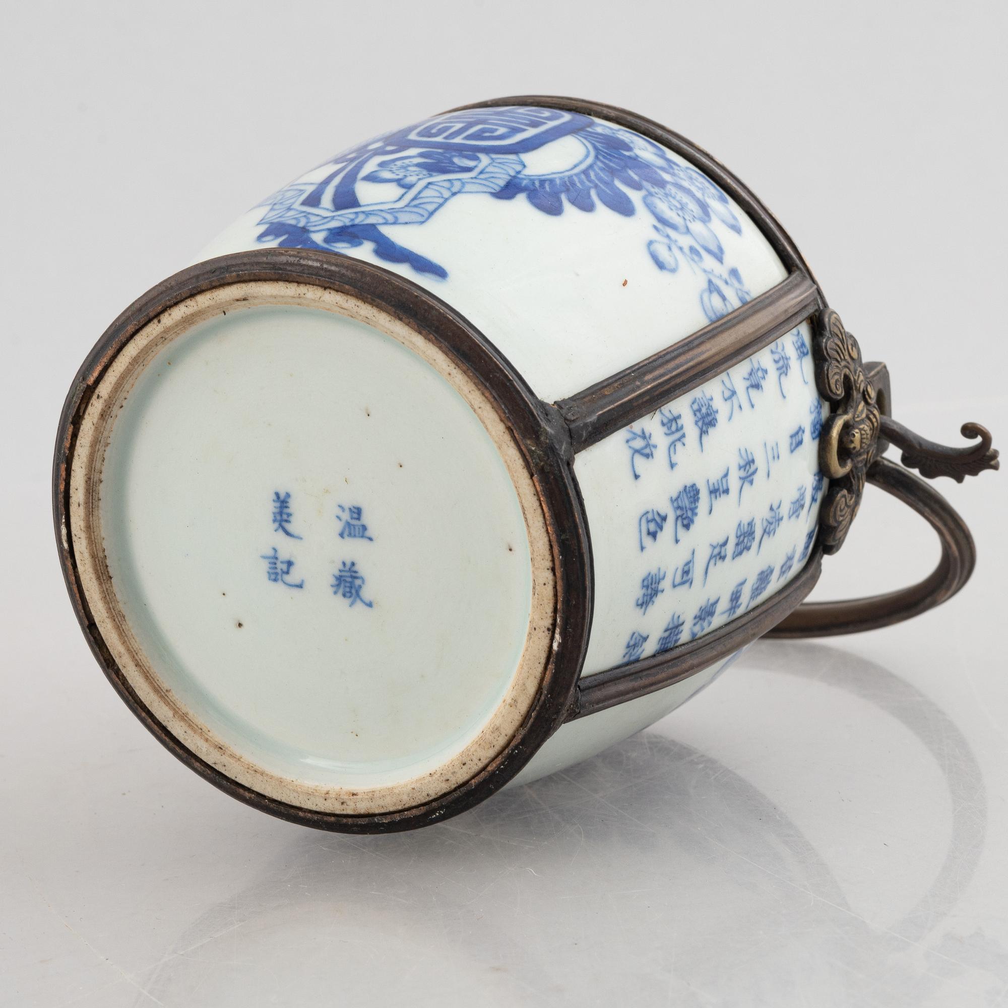 A metal mounted porcelain ewer, late Qing dynasty.