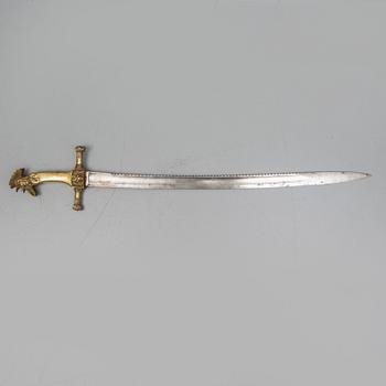 An early 19th Century Napoleonic rooster head sword. Curved blade with saw back marked Manufacture de Klingentahl Coleau.