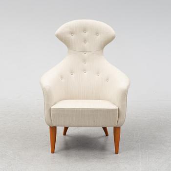 Kerstin Hörlin-Holmqvist, a 'Stora Eva' lounge chair from Nordiska Kompaniet's 'Paradiset'-seires.