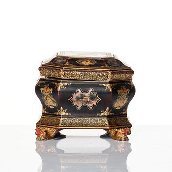 A Chinese lacquered tea caddy with pewter boxes, Qing dynasty, 19th Century.