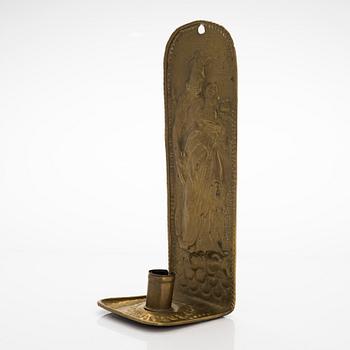 A 18th/19th century Flemish brass candle holder.