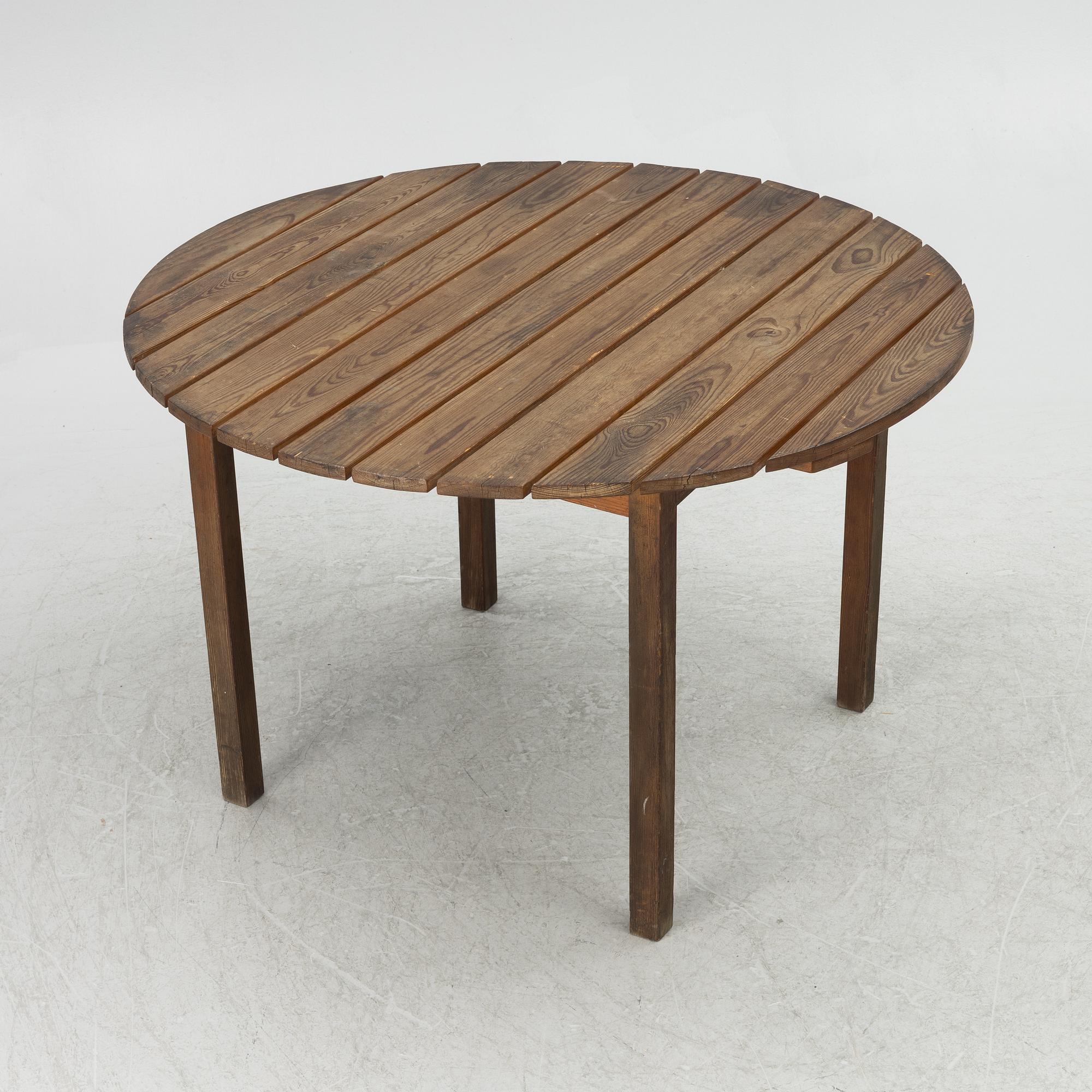 Carl Malmsten, garden furniture, a table and two armchairs. "Bergshamra", second half of the 20th century.