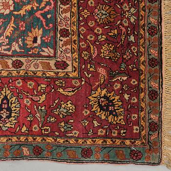 A rug, a semi-antique silk Turkish with metal brocade, ca 194-195 x 127,5-132,5 cm.