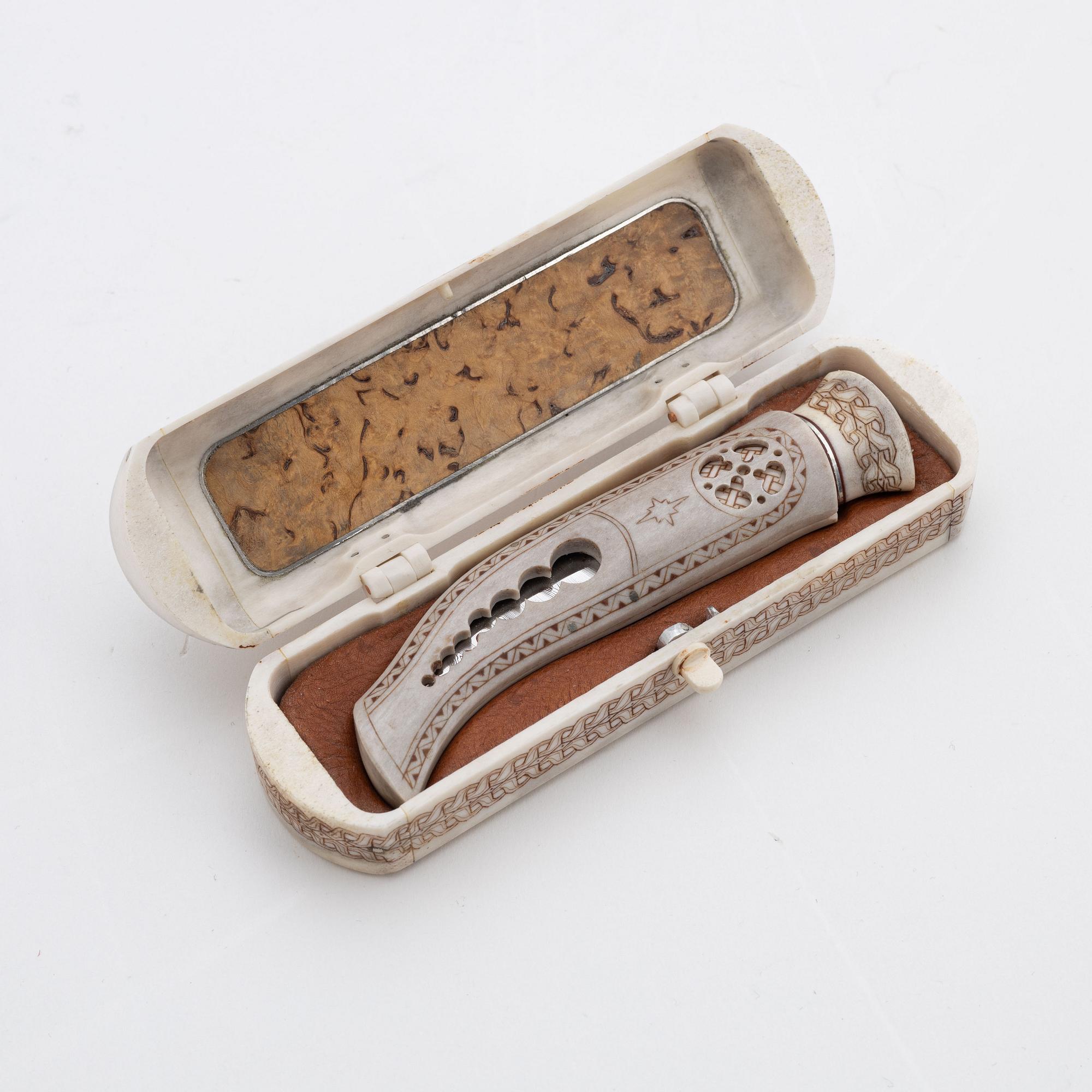 A reindeer horn knife in box by Bertil Fällman, signed.