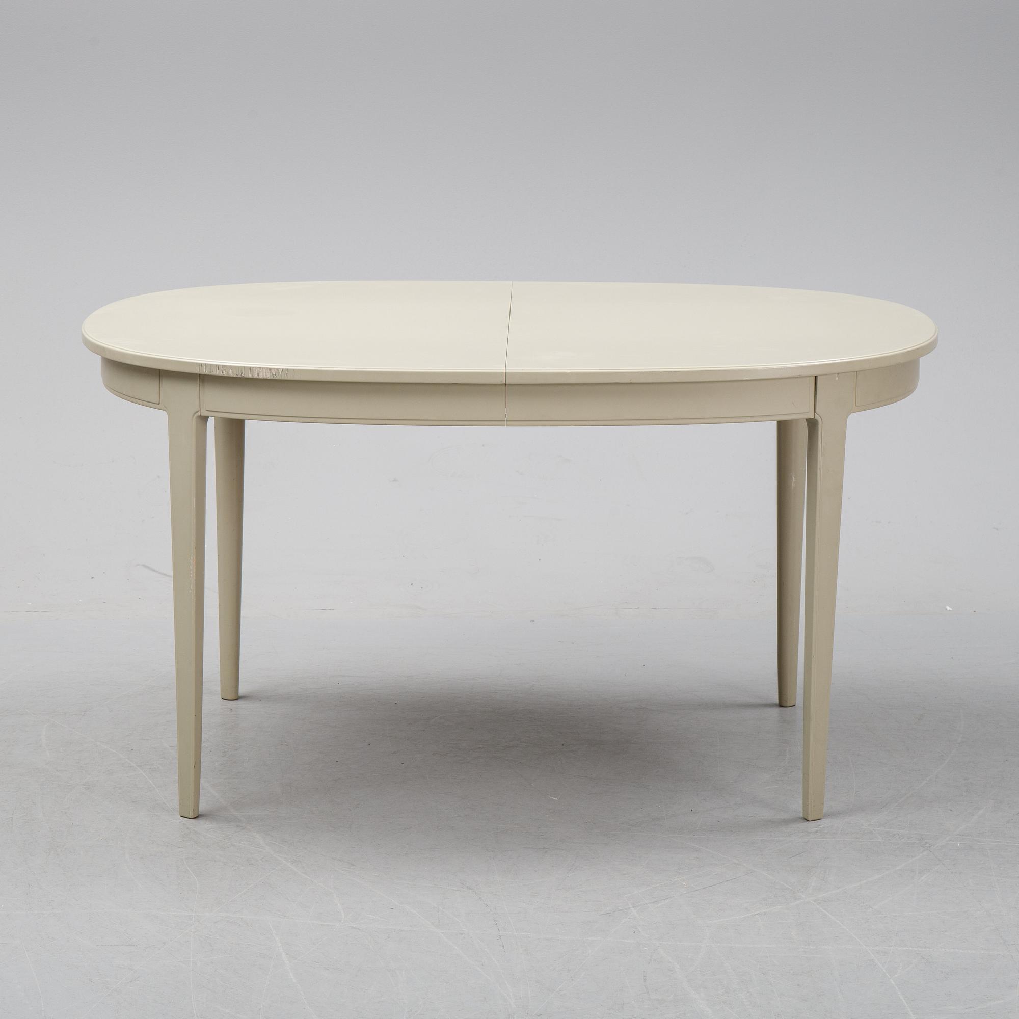 A dining table with two armchairs and six chairs by Carl Malmsten for Bodafors.