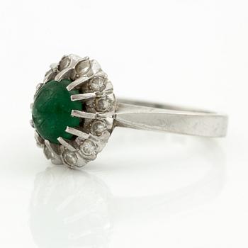 Ring, 18K white gold with cabochon-cut emerald and brilliant-cut diamonds.