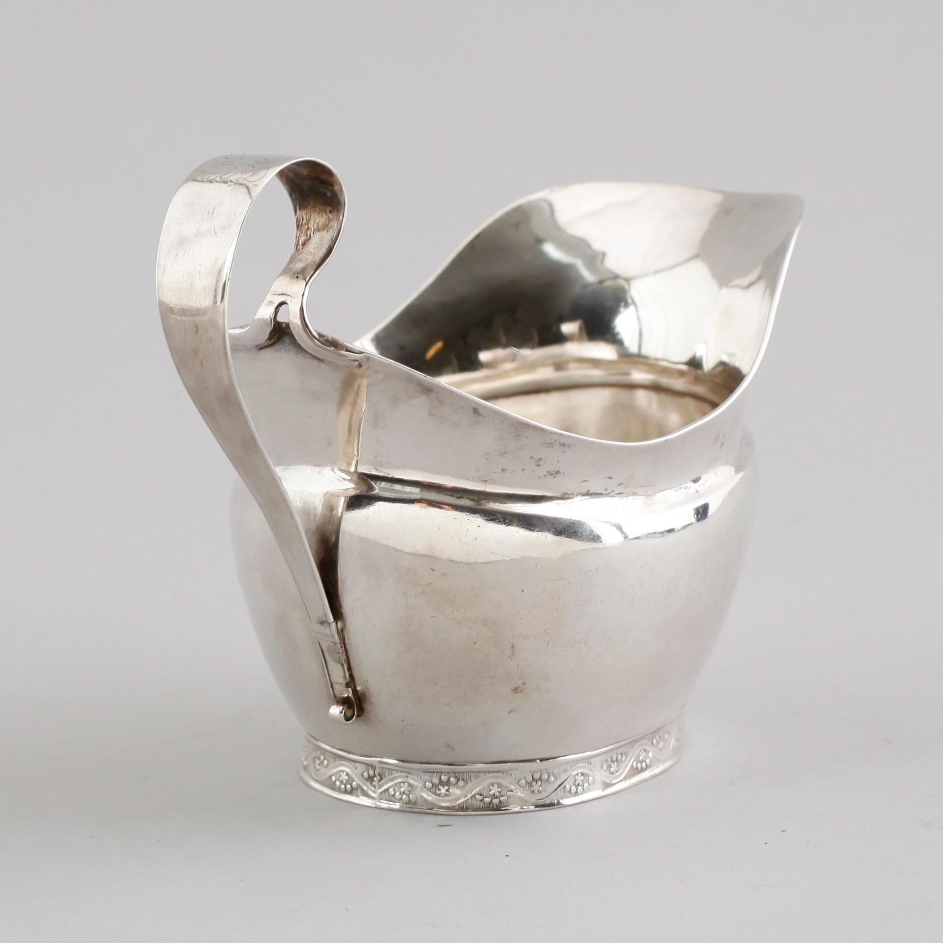 GRÄDDKANNA, silver, Anders Emanuel Blomqvist, Vadstena 1827. Vikt ca 143 gram.