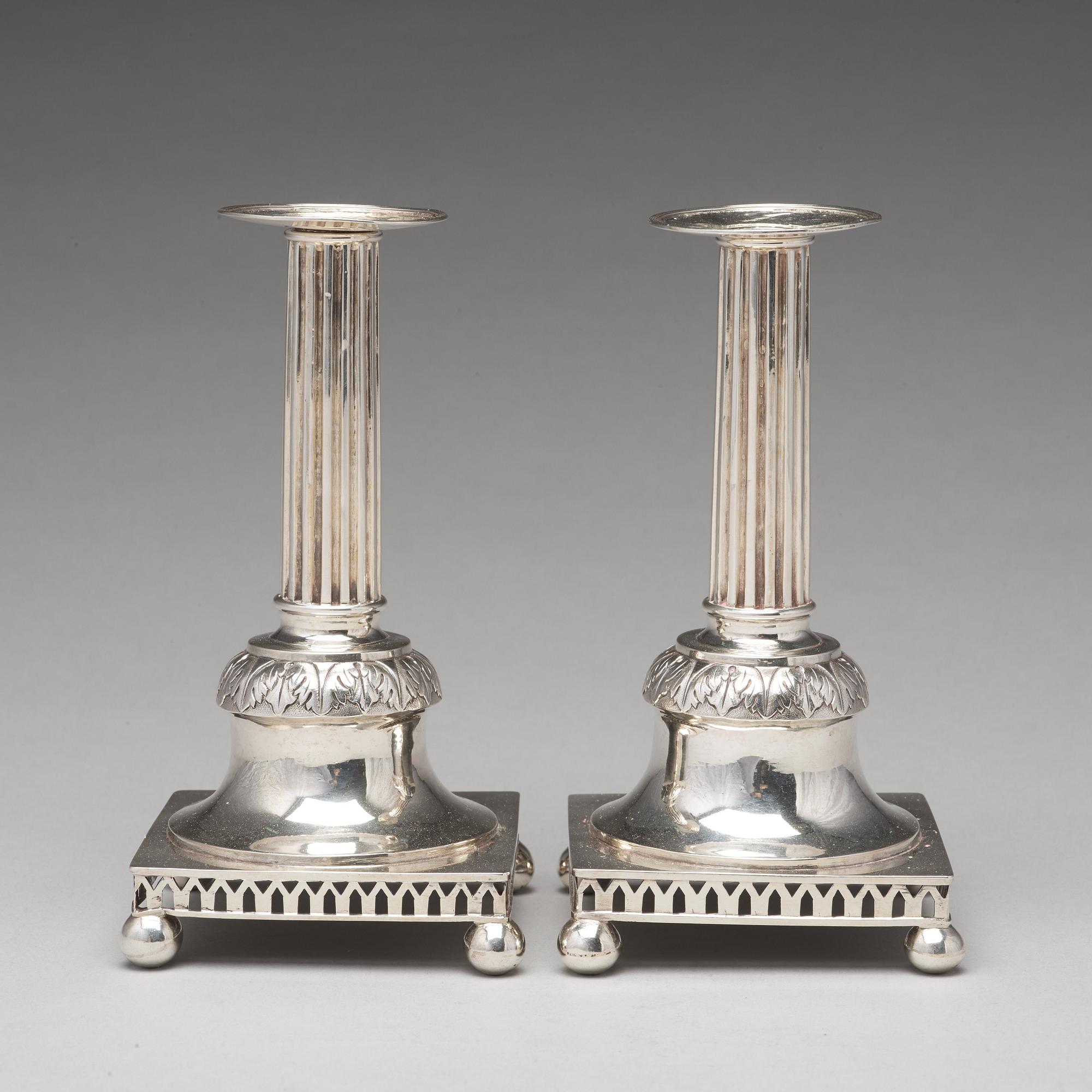 A pair of Swedish aerly 19th century silver candlesticks, mark of Carl Gustaf Blomborg, Stockholm 1815.