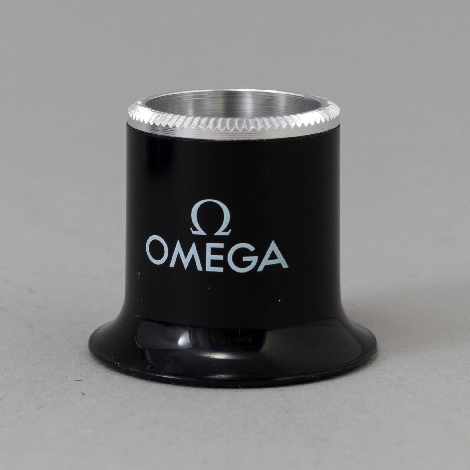 OMEGA, Pen / Loupe / Velcro strap.