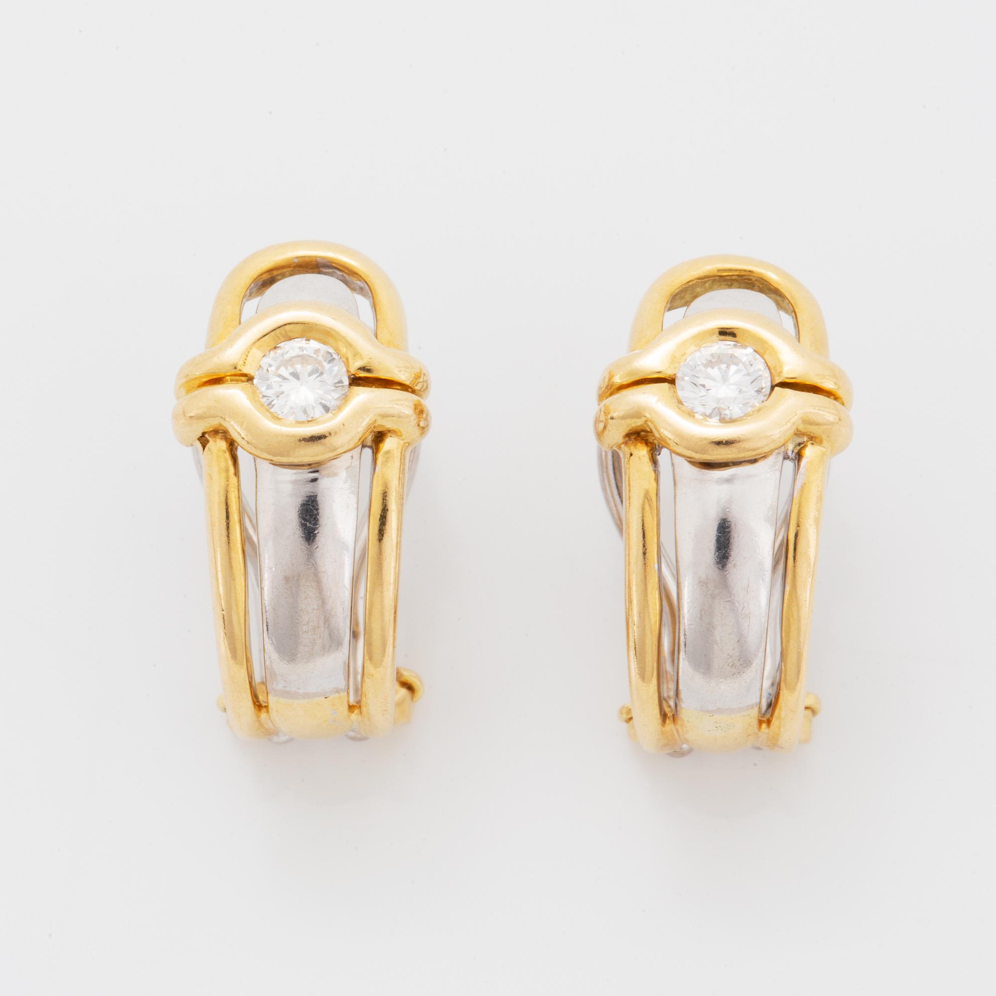 A pair of 18K gold earrings.