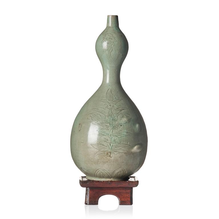 A Korean Celadon glazed double gourd bottle, Koryo dynasty, 12/13th century.