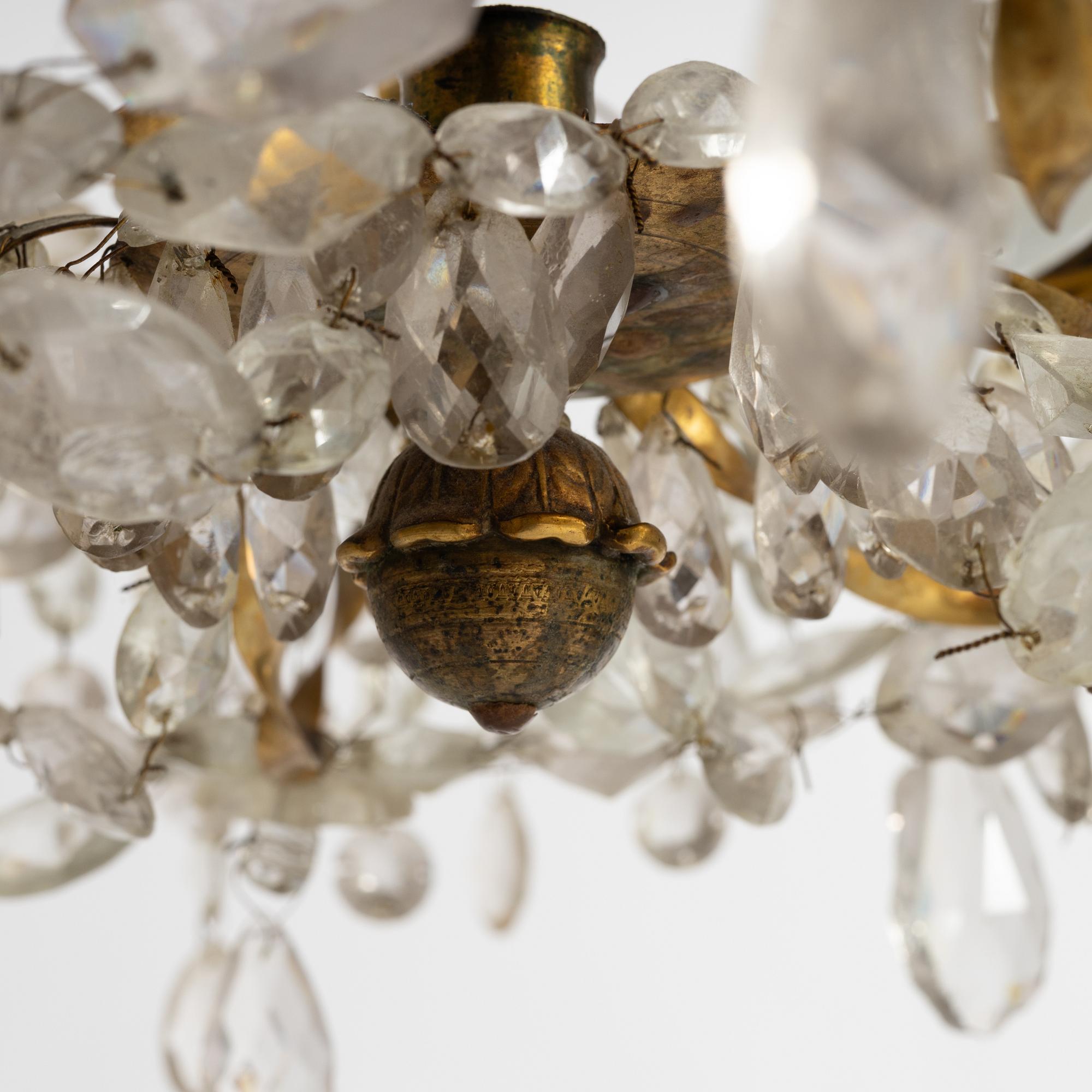 A late Gustavian gilt brass and cut glass seven-light chandelier, Stockholm, late 18th century.