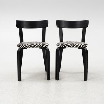 Alvar Aalto, a dining table and eight chairs, model 69, Artek, Finland, end of the 20th century.