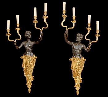 1265. A pair of Louis Philippe 1830/1840's gilt and patinated bronze four-light wall-lights.