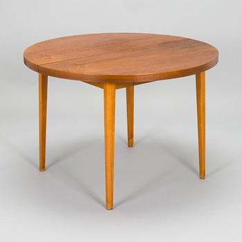 A mid-20th century teak veneered table.