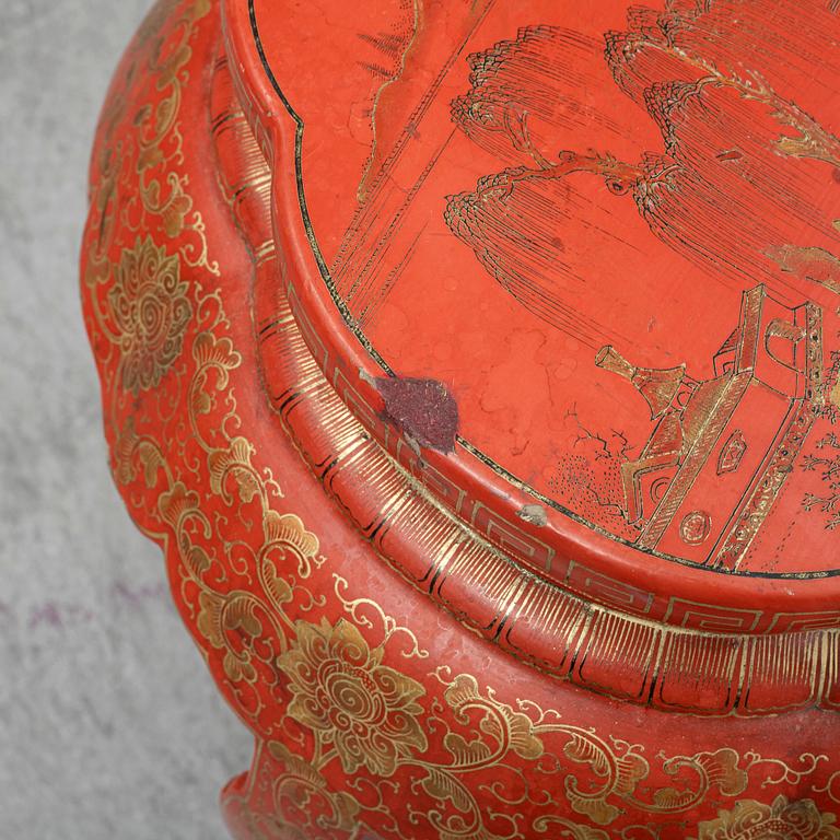 A Chinese red lacquered stool, early 20th century.