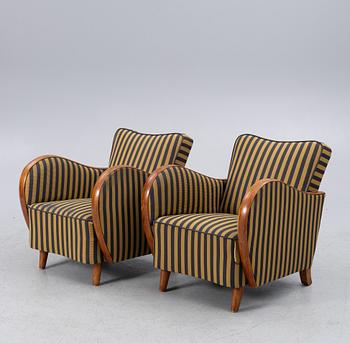 Club armchairs, a pair from the 1930s.