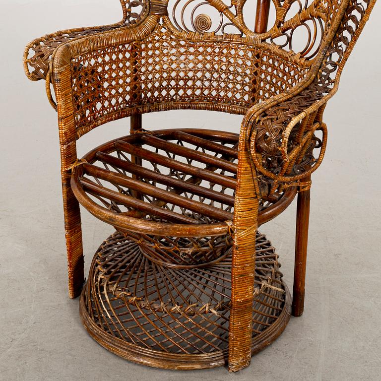 A RATTAN ARMCHAIR.