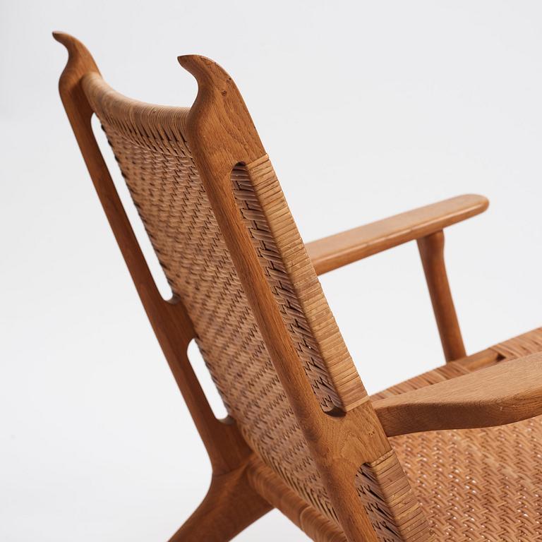 Hans J. Wegner, a pair of oak easy chairs 'CH27', Carl Hansen & Son, Denmark, 1950s.