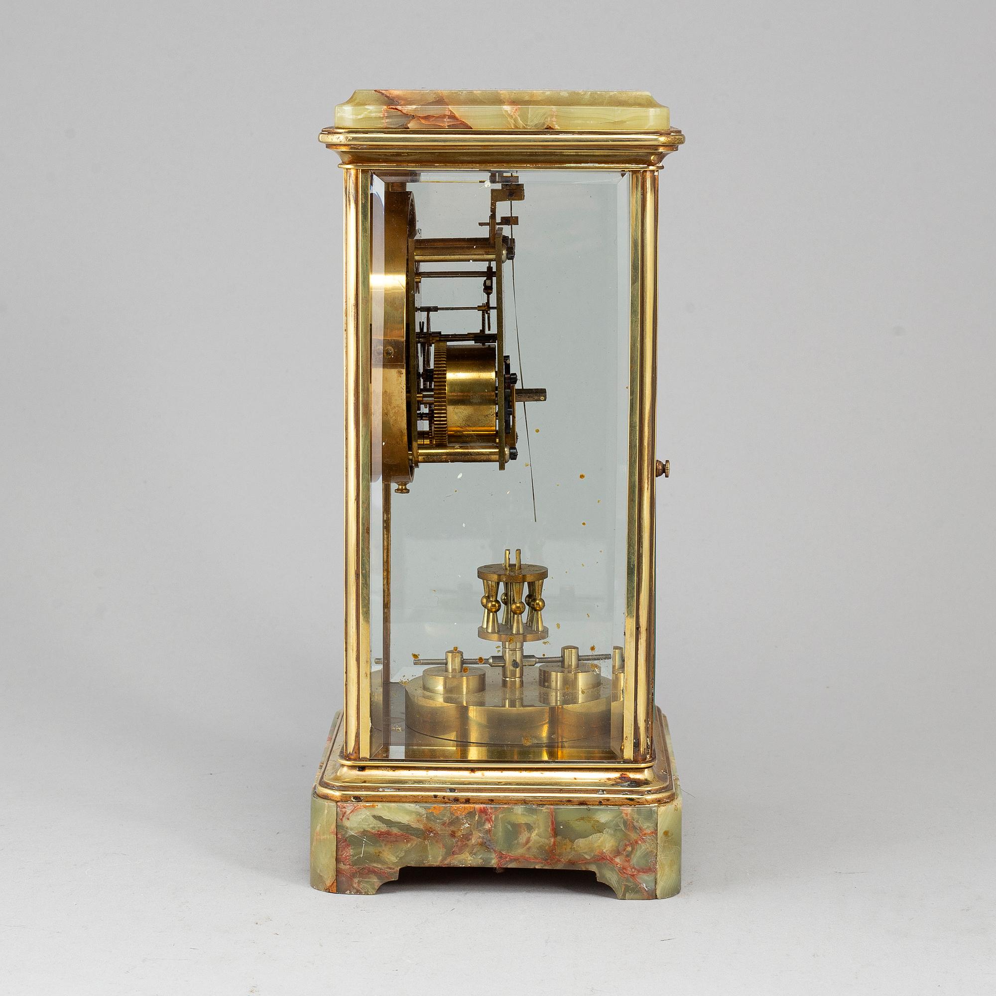 A French onyx and brass mantel clock, first half of the 20th century.