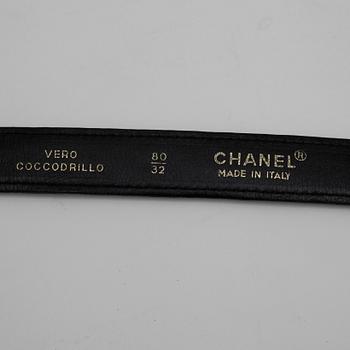 CHANEL, a black crocodile leather belt.