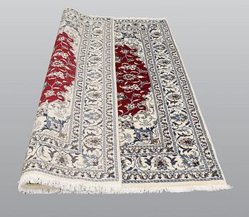 A rug, Nain part silk, ca 208 x 149 cm.