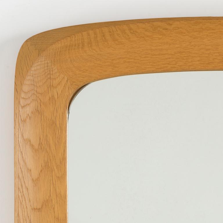 a mid- 20th-century oak mirror.