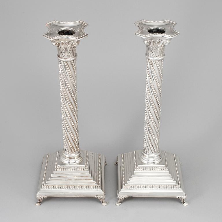 A pair of sterling silver candlesticks from Topazio, Portugal, late 20th Century.