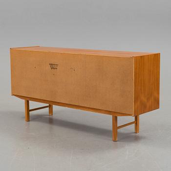 A 1960´s sideboard venereed in teak.