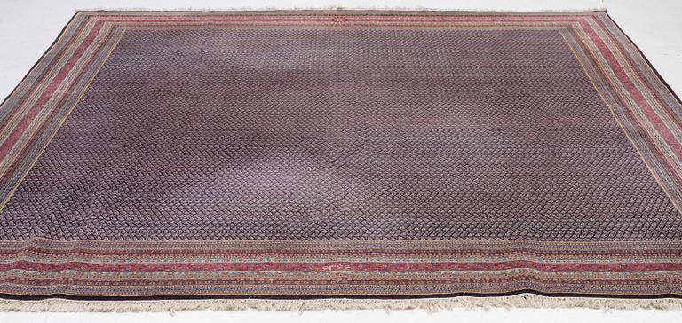 A oriental carpet, signed, c. 295 x 295 cm.