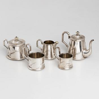 A five-piece Russian parcel-gilt tea set, maker's mark B.A. for Vasili Andrejev or Vasili Akimov, Moscow, 1898-1914.