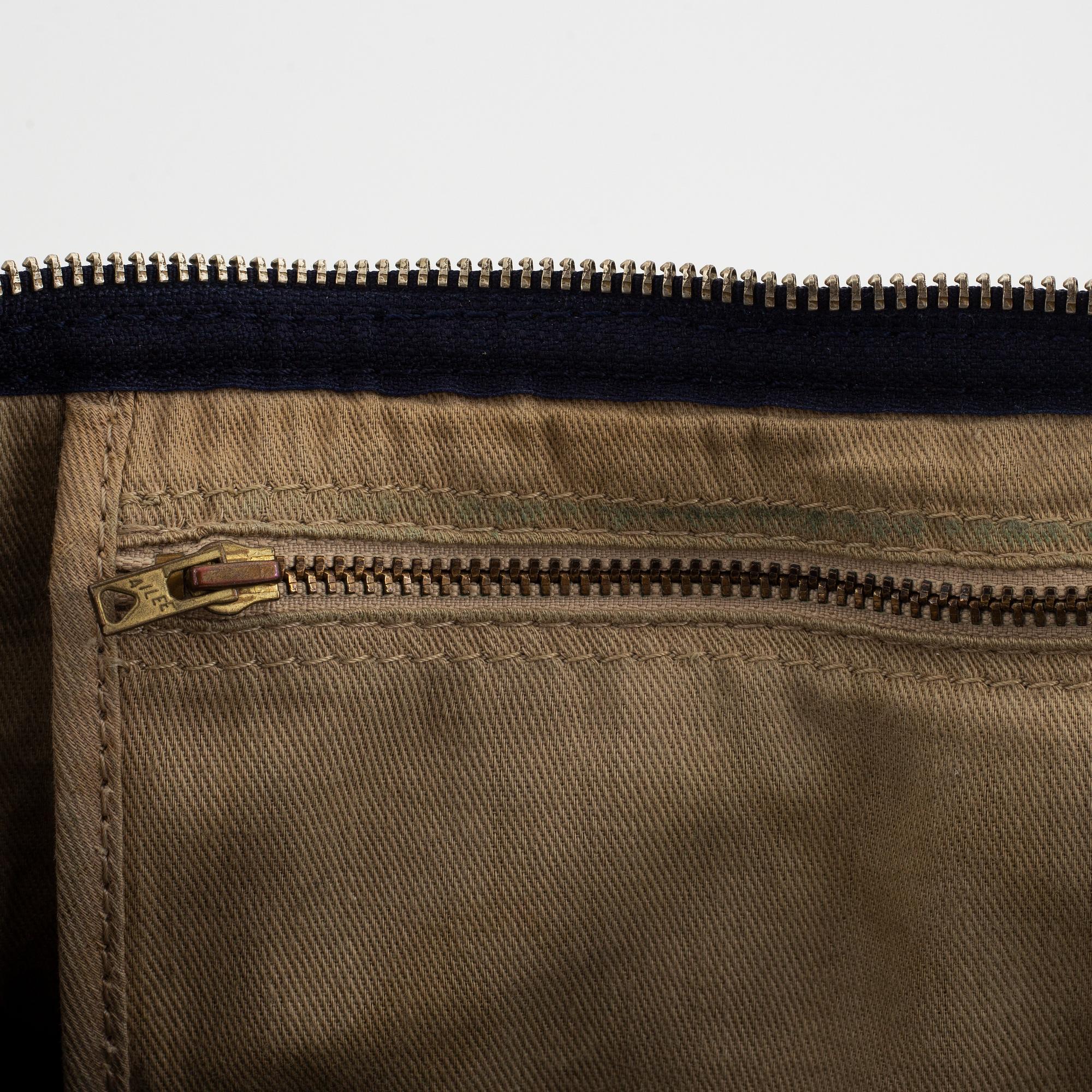 Christian Dior, a canvas handbag, toilet bag and key holder.