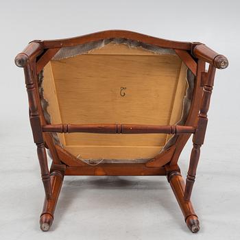 A Gustavian style dining table with two armchairs and four chairs, late 20th century.