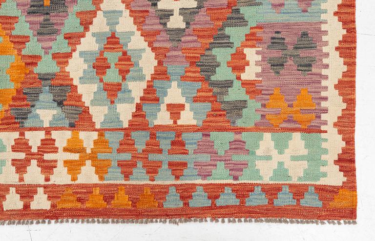 A kilim carpet, c. 295 x 203.