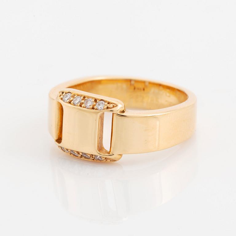 Hermès 18K gold ring set with round and brilliant-cut diamonds.